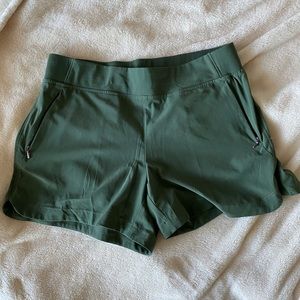 NWOT Calia by Carrie Underwood athletic wear shorts with zipper pockets.